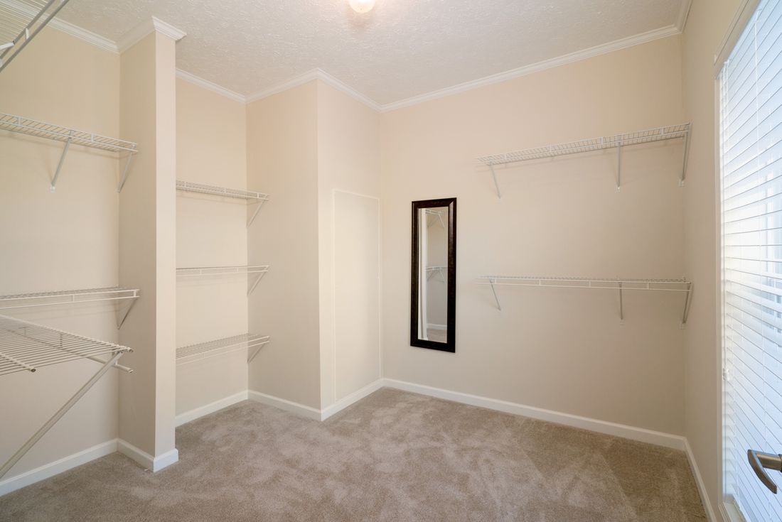 The 1545 JAMESTOWN Primary Bedroom closet. This Manufactured Home features 3 bedrooms and 2 baths.