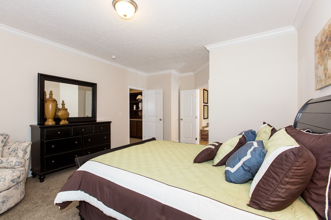 The J533 MOD Primary Bedroom. This Manufactured Mobile Home features 3 bedrooms and 2 baths.