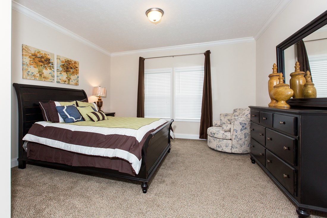 The J533 MOD Primary Bedroom. This Manufactured Mobile Home features 3 bedrooms and 2 baths.